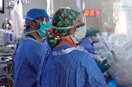 Two staff members participating in a surgery